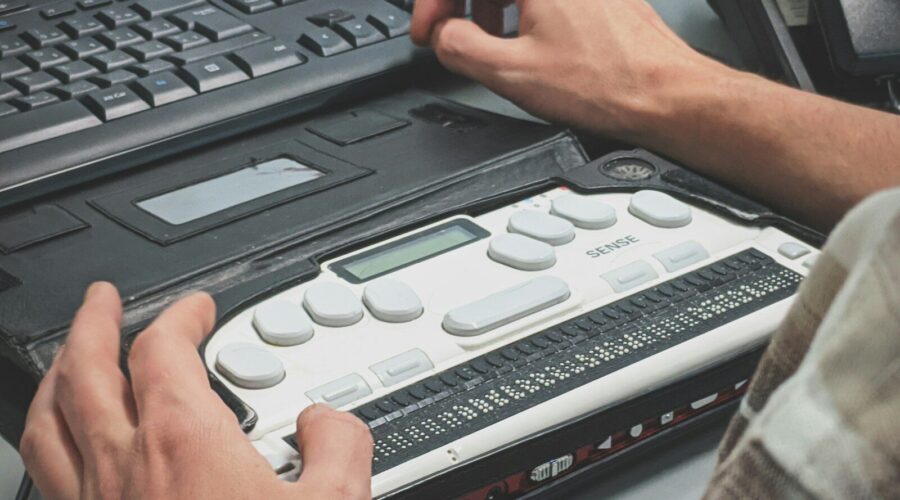 person using braille writer
